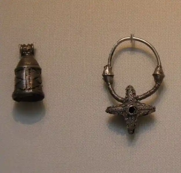 Slavs distinctive jewelry, earring with star-like cross design